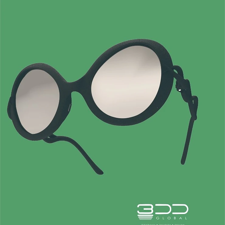 Black-rimmed oval eyewear on sage green background